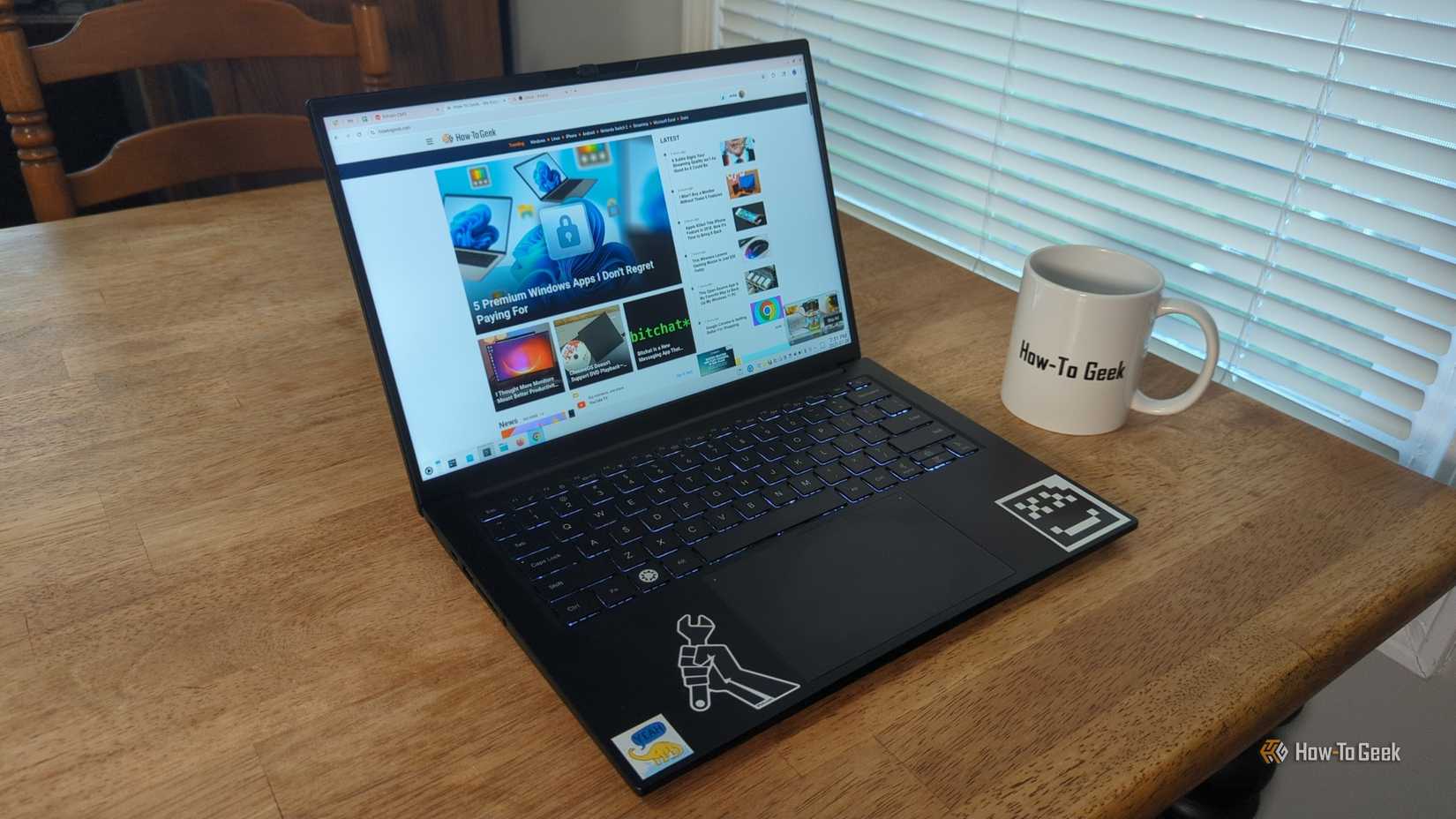 /images/a-kubuntu-focus-ir14-laptop-next-to-a-coffee-mug-on-a-table.jpg