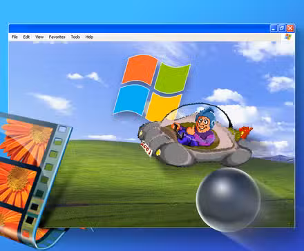 /images/a-windows-xp-window-with-the-bliss-wallpaper-the-movie-maker-filmstrip-logo-and-the-3d-pinball-ball-in-front.png