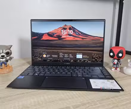 /images/windows-11-laptop-with-figurines.jpg